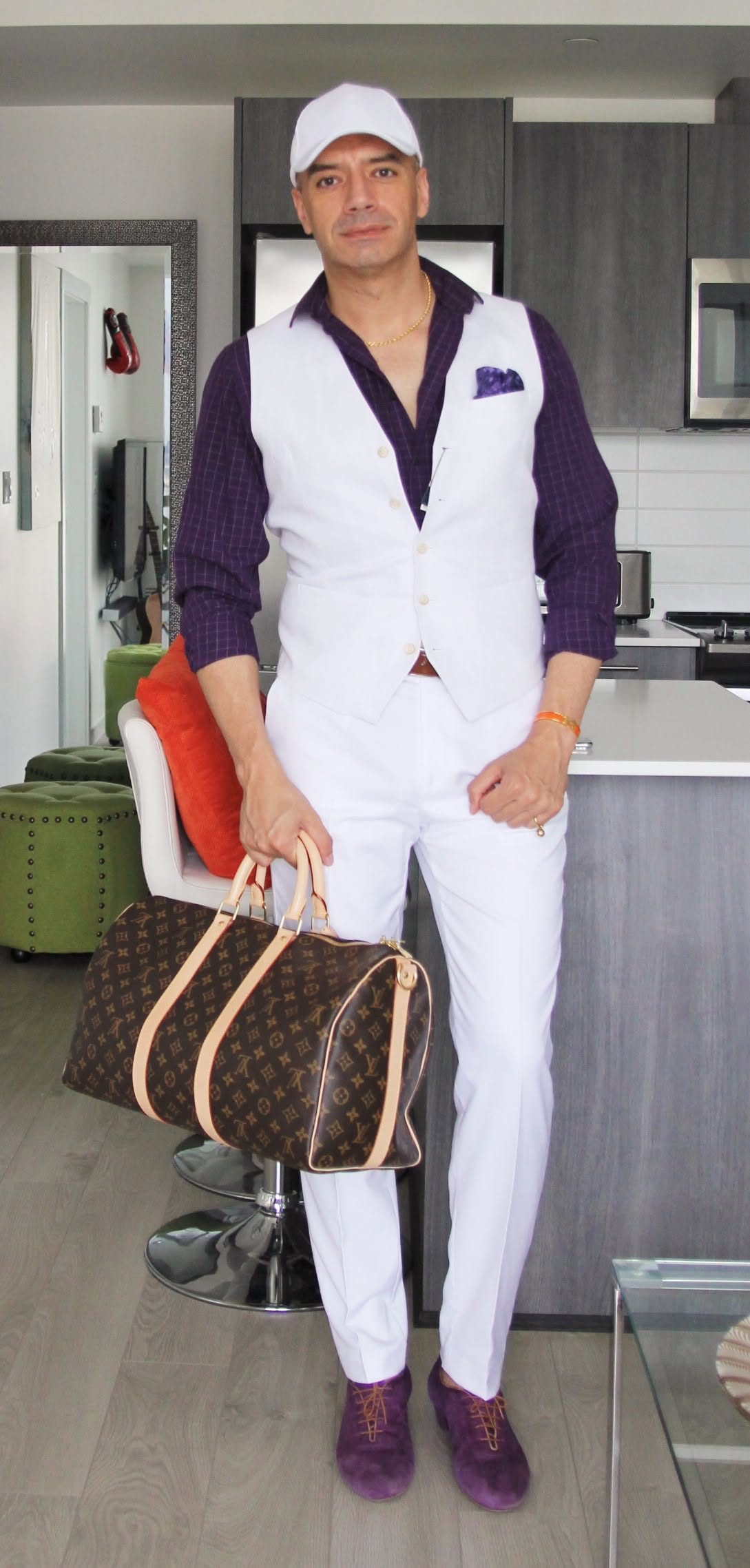 Abdu dressed in white and purple, wearing custom purple dance shoes