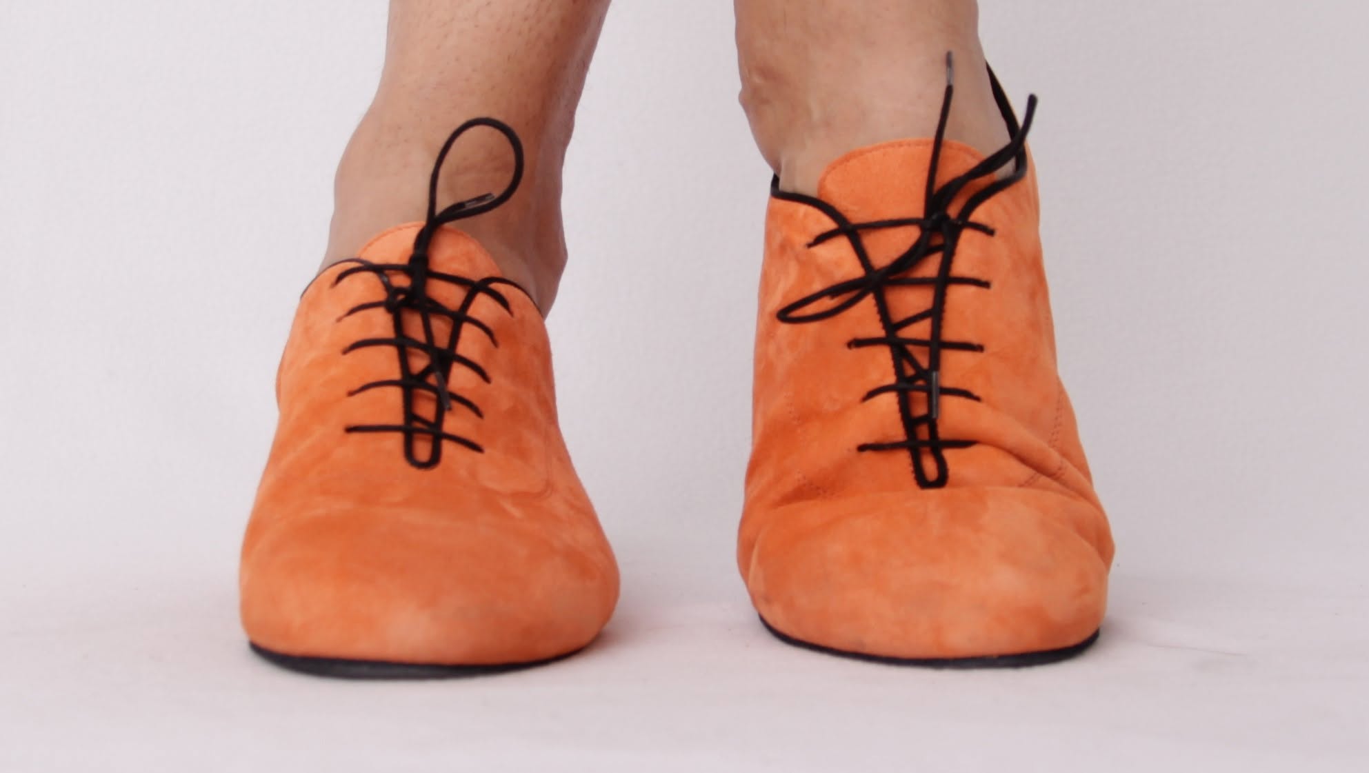 Front view of custom orange suede men's dance shoes