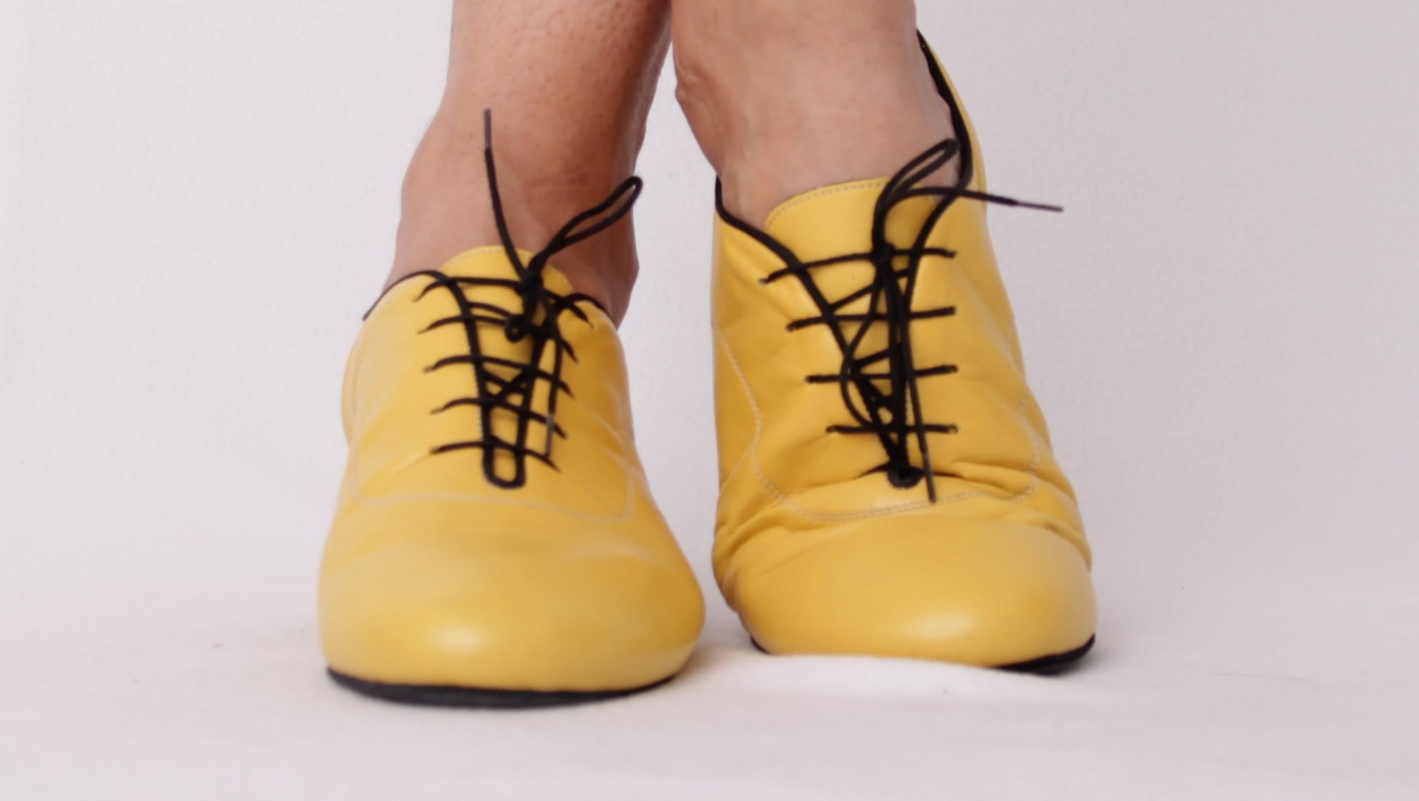 Front view of custom yellow suede men's dance shoes